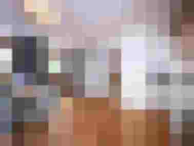 Modern apartment in the Hinterburghof with dining area and view of the countryside.